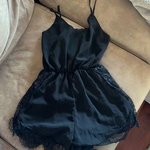 Black sheer romper with lace detail size small.. adjustable straps